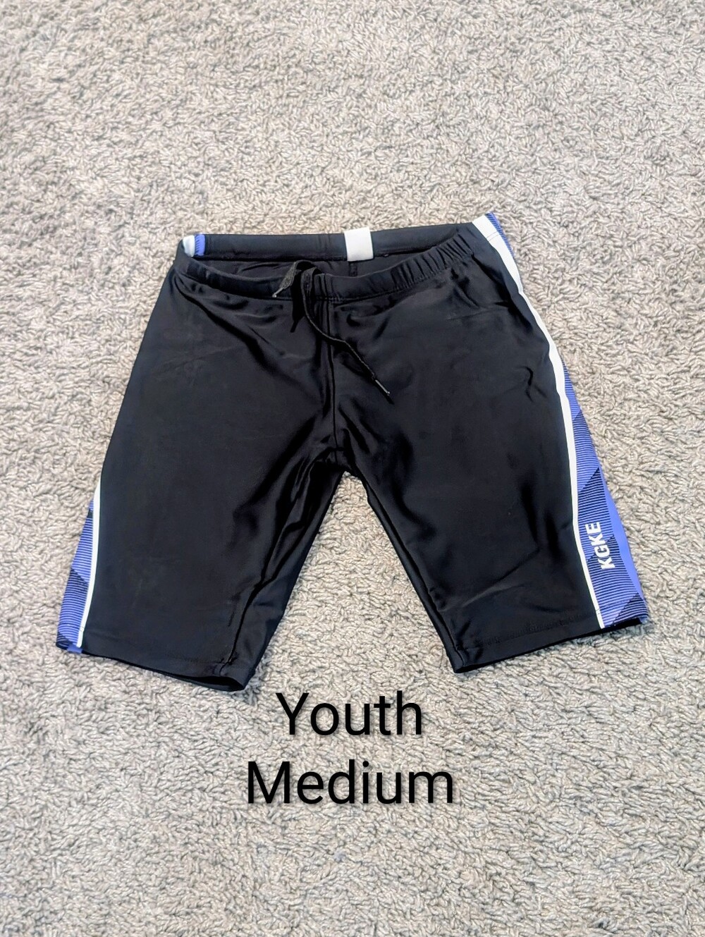 Youth medium swim jammers black white blue swimming team shorts suit